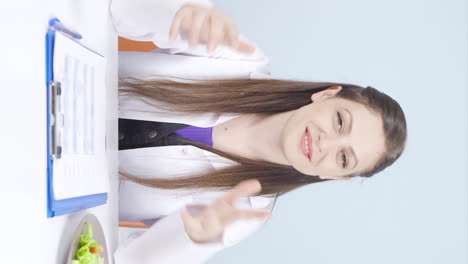 Vertical-video-of-Nutritionist-laughing-at-camera.